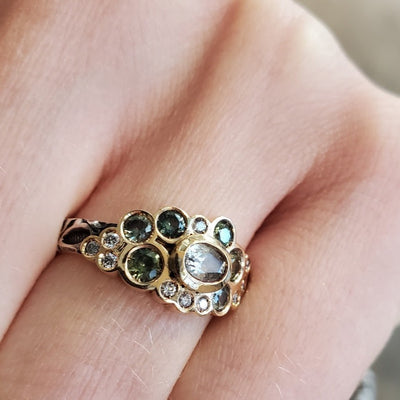 Hand stamped sterling silver ring with a bubble of stunning green Australian sapphires, diamonds, and 18k gold. 