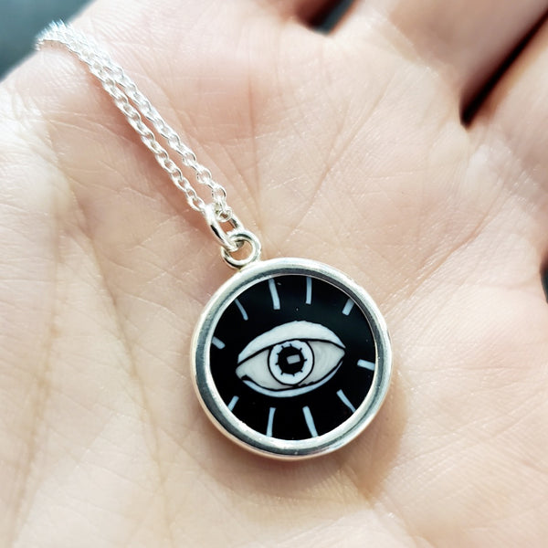 Evil eye: small murrine glass pendant on a 17" sterling silver chain.