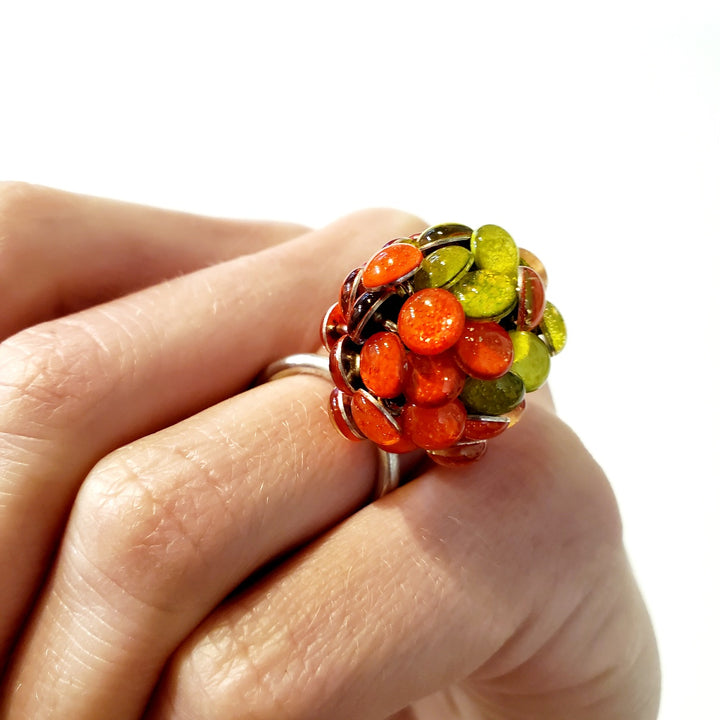 Round Orange and Yellow Resin Ring. Droplets of yellow and orange resin and sterling silver are sewn in with purple thread. This 2.2cm x 2.2cm centerpiece sits on a size 6.5 sterling silver shank.
