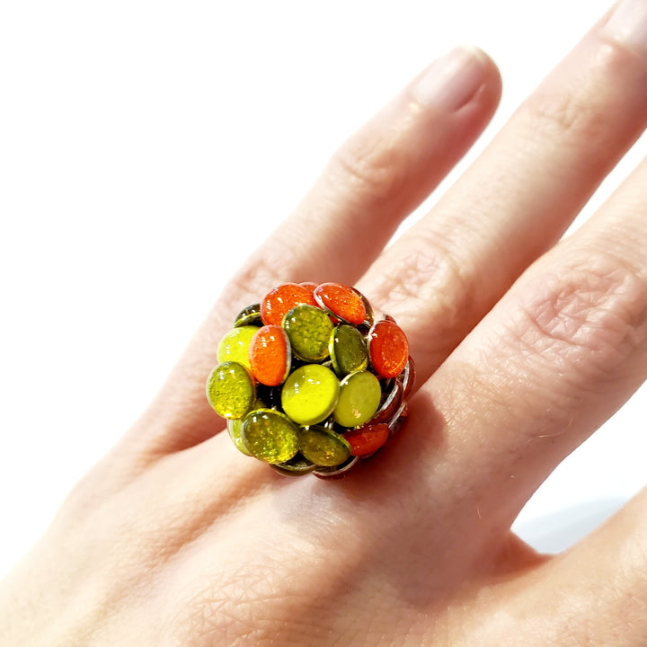 Round Orange and Yellow Resin Ring. Droplets of yellow and orange resin and sterling silver are sewn in with purple thread. This 2.2cm x 2.2cm centerpiece sits on a size 6.5 sterling silver shank.