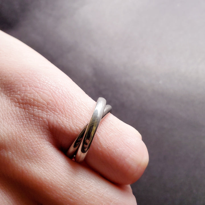 Interlocking rings of sterling silver and titanium, size 6.5.