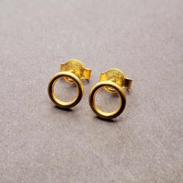 Tiny 14k gold circle stud earrings.