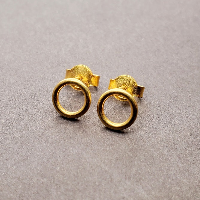 Tiny 14k gold circle stud earrings.
