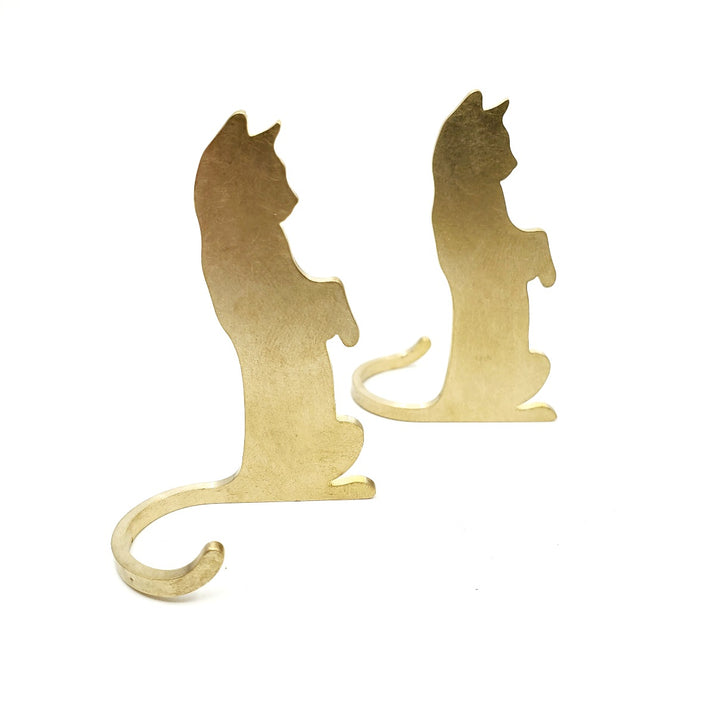 Brass cats: standing. Charming brass table object which can be posed facing to the left or to the right. Sold individually.