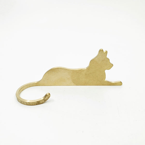 Brass cat lounging. Charming brass table object which can be posed facing to the left or to the right. Sold individually.