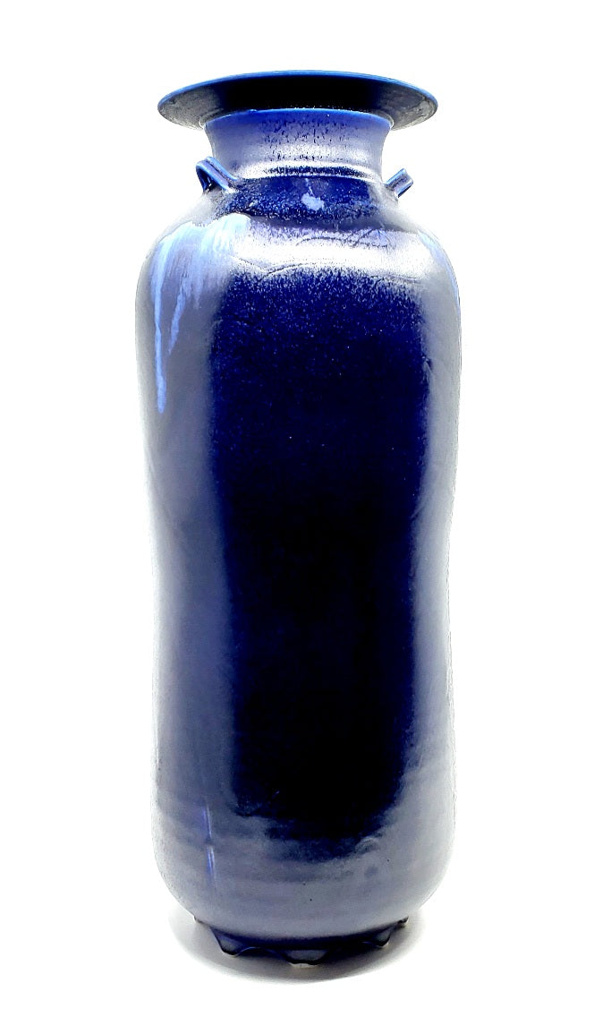 Tall cobalt blue vase. This large scale vessel has three decorative handles so two can be seen from any angle. 