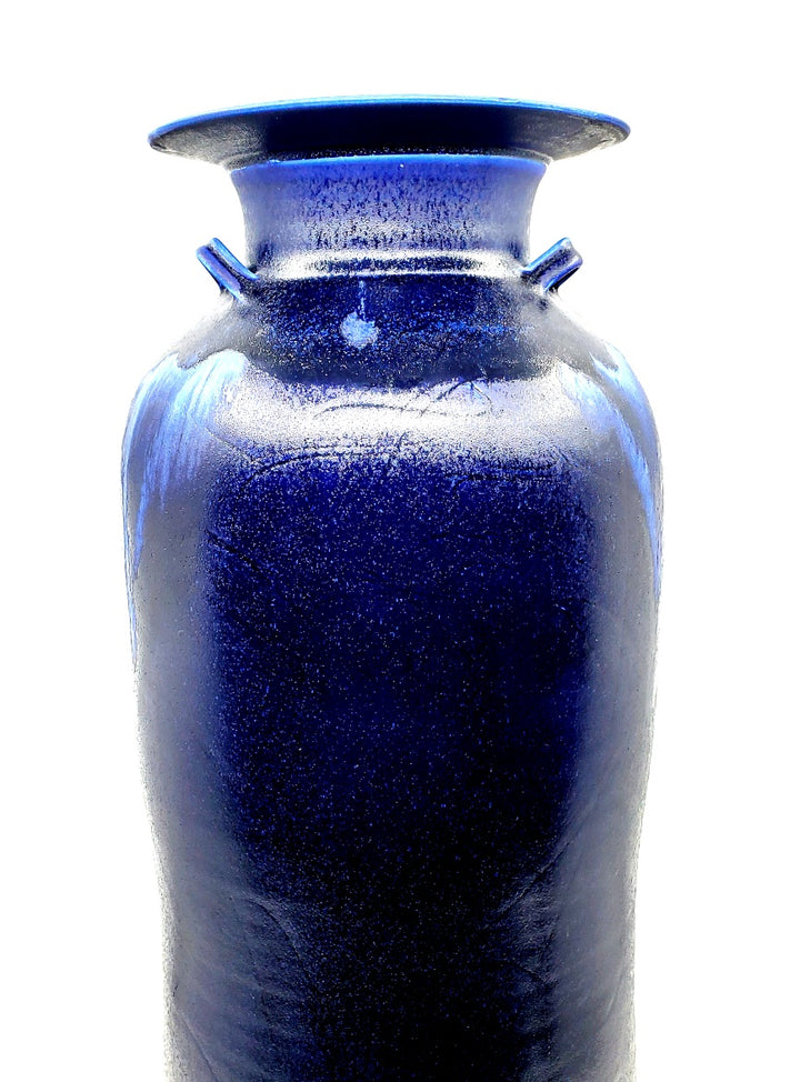 Tall cobalt blue vase. This large scale vessel has three decorative handles so two can be seen from any angle. 