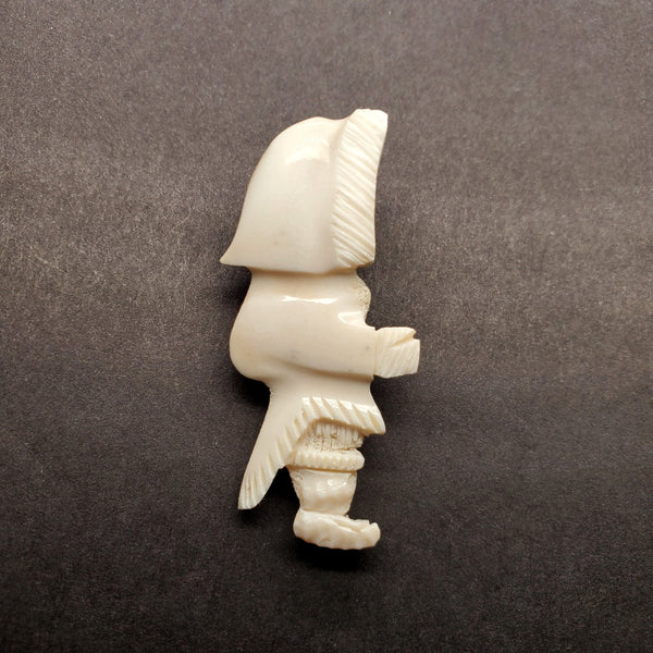 Inuk woman brooch in caribou antler.
