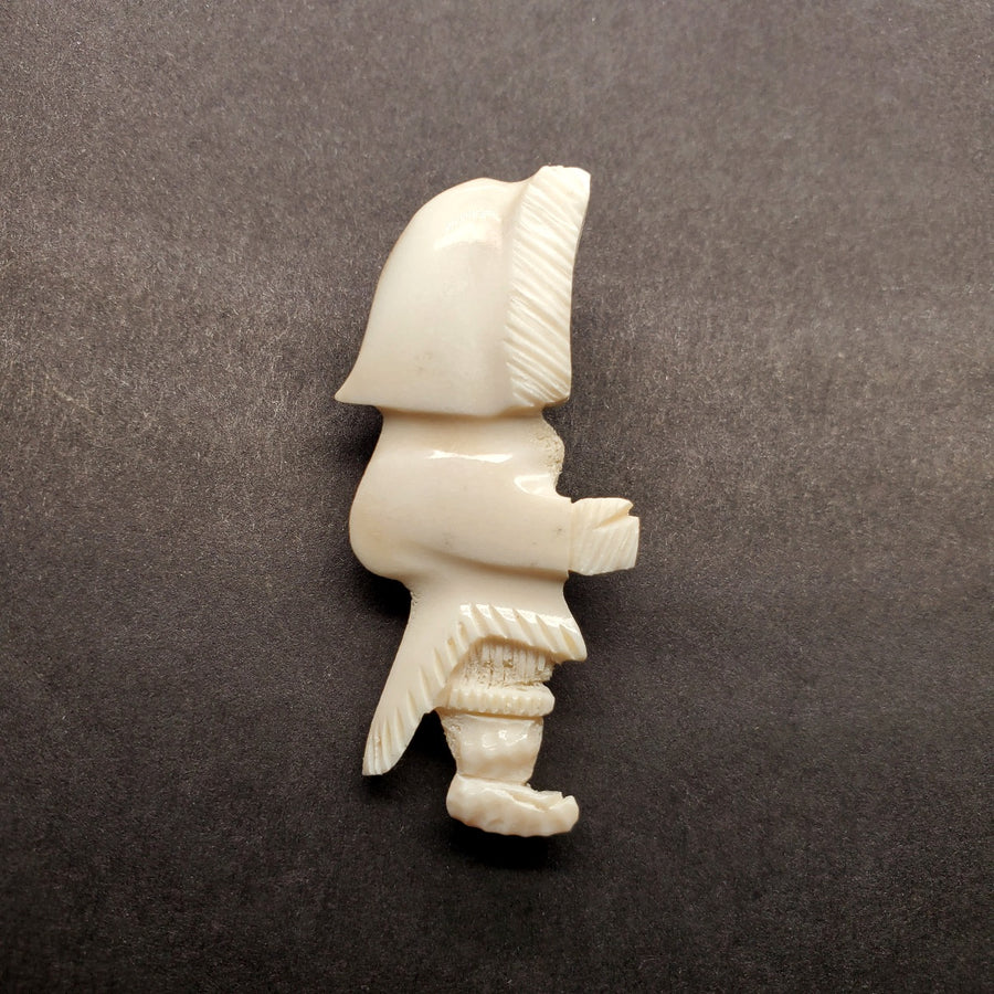 Inuk woman brooch in caribou antler.