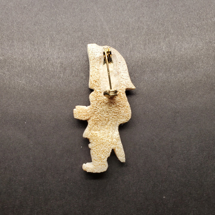 Inuk woman brooch in caribou antler.