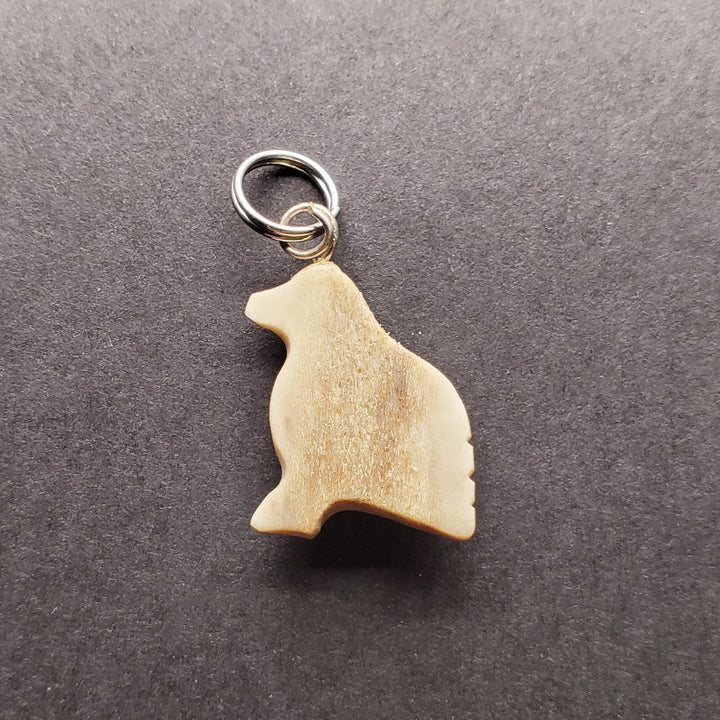 Small snow bunting pendant made from caribou antler.