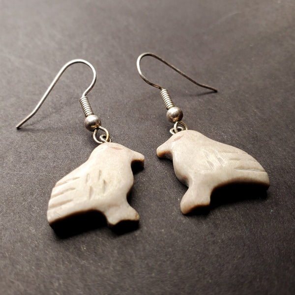 Small snow bunting drop earrings of caribou antler.