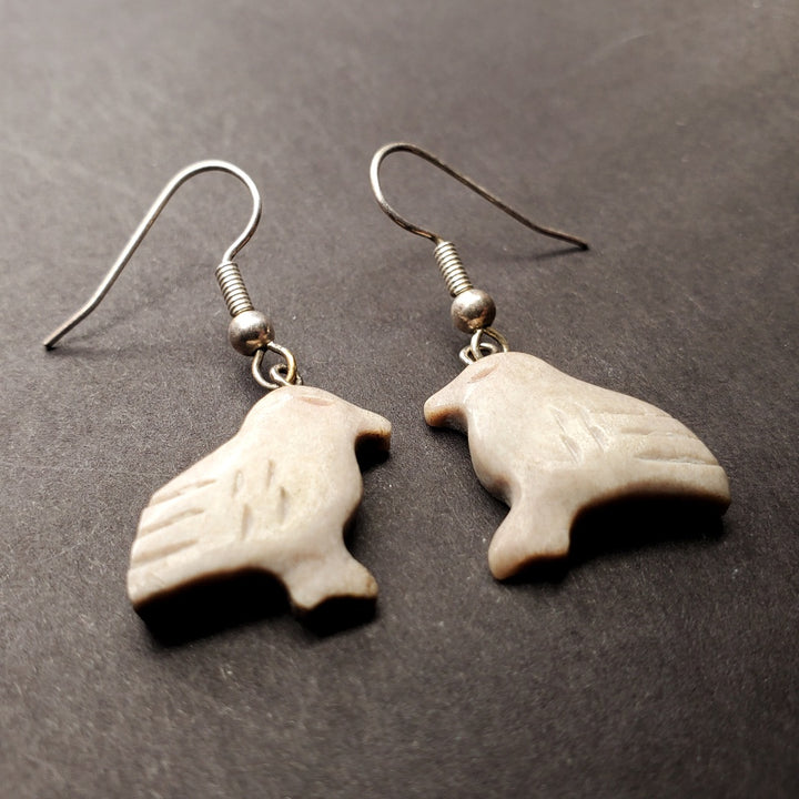 Small snow bunting drop earrings of caribou antler.