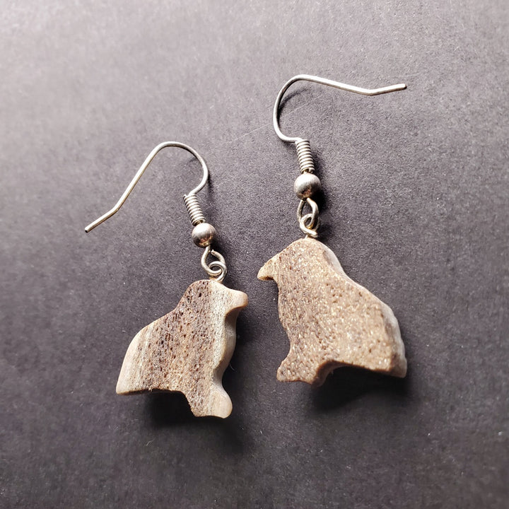 Small snow bunting drop earrings of caribou antler.