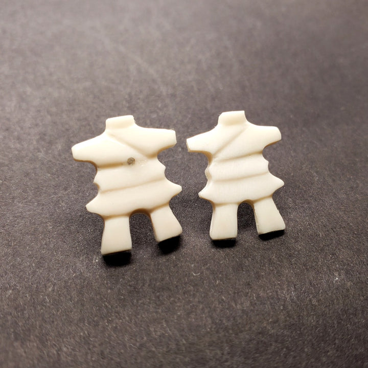 Inukshuk stud earrings in walrus ivory.