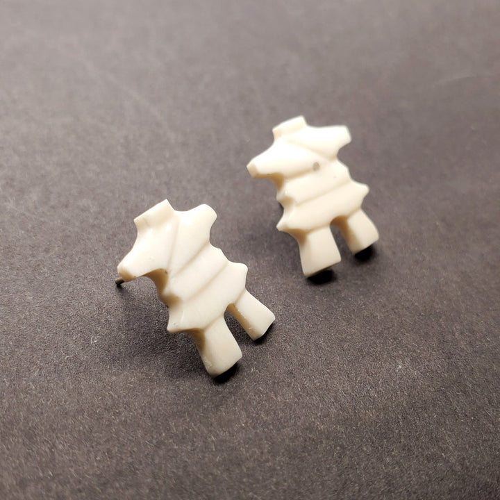 Inukshuk stud earrings in walrus ivory.