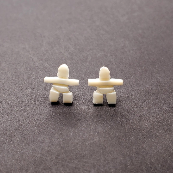 Inukshuk mini stud earrings in walrus ivory from Iqaluit.