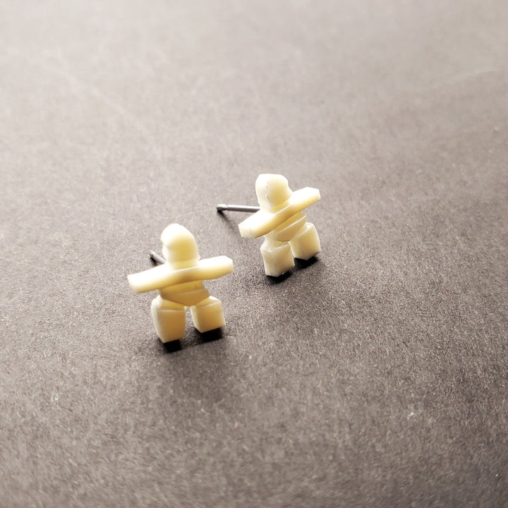 Inukshuk mini stud earrings in walrus ivory from Iqaluit.