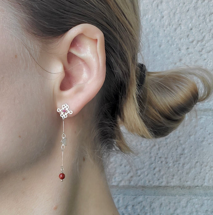 Feeesh Amulet earrings of sterling silver, ruby, and jasper beads. 