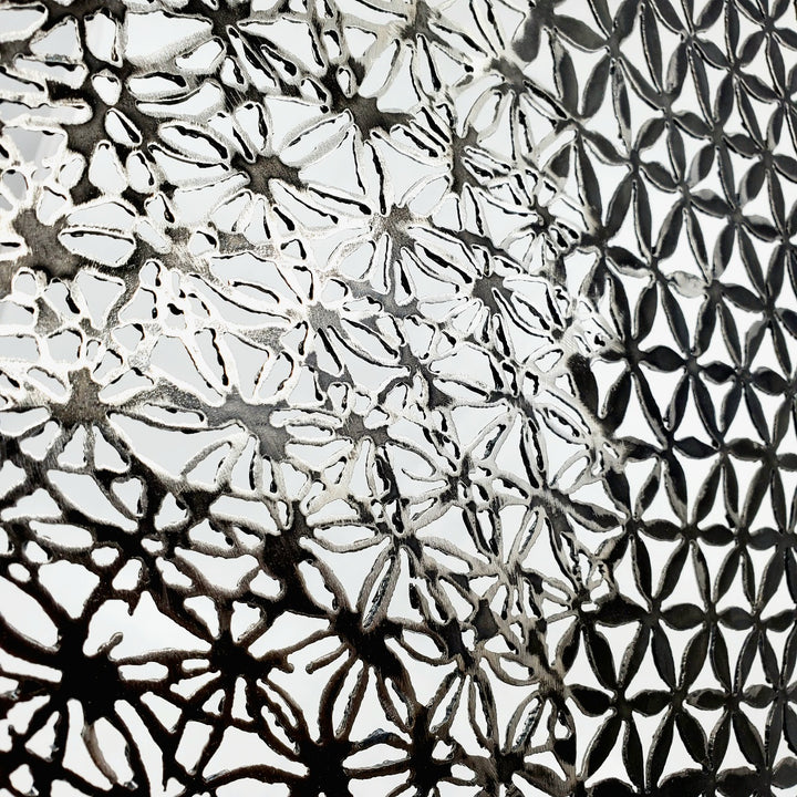 Pattern 3 (petals and bloom), 2022. Wall sculpture made from plasma-cut steel.