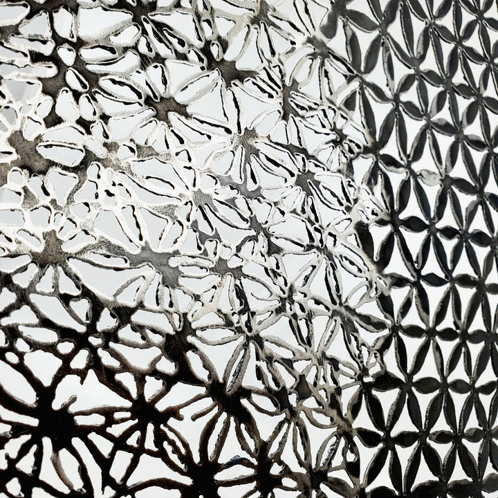 Pattern 3 (petals and bloom), 2022. Wall sculpture made from plasma-cut steel.