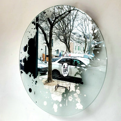 Spill, etched circular mirror. 16" in diameter. AVAILABLE