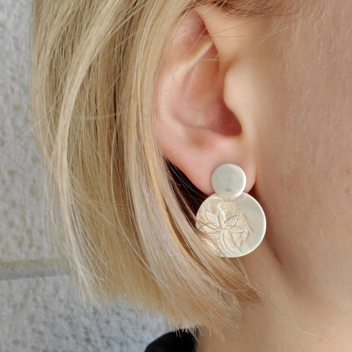 Hand-tooled sterling silver stud earrings.