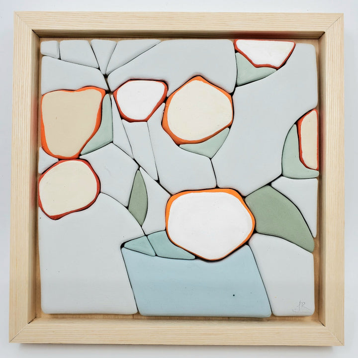 All Things - Hand molded clay coloured pieces within a solid wood frame, depicting a still life of white and orange flowers.  Measures 25 x 25 x 2.5 cm