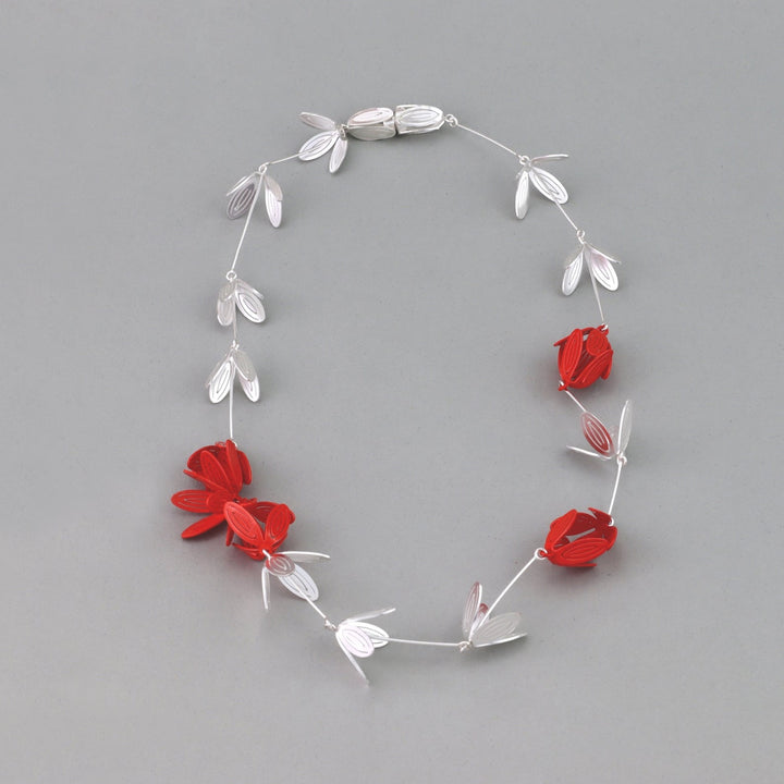 Petal Necklace: Orange Blossom and Silver 18”x2.5x1.5cm Sterling Silver, Steel (clasp), Powder Coat  Techniques: Hand cutting