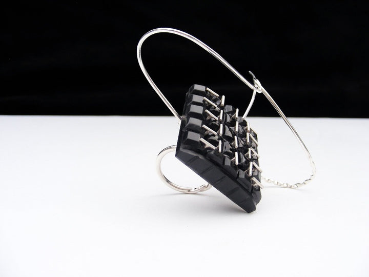CHNL.MONOLITH ﻿ring in sterling silver, acrylic, and black onyx by Anna Lindsay MacDonald.