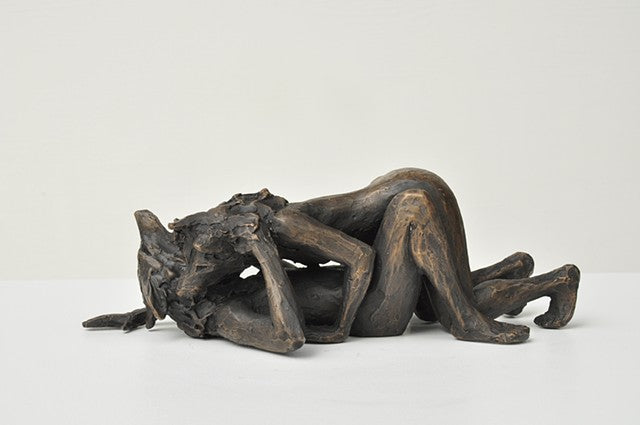 She Wolves in double. One She Wolf pinning down another. Individual cast bronze sculpture, approx. 7" x 4" x 3".