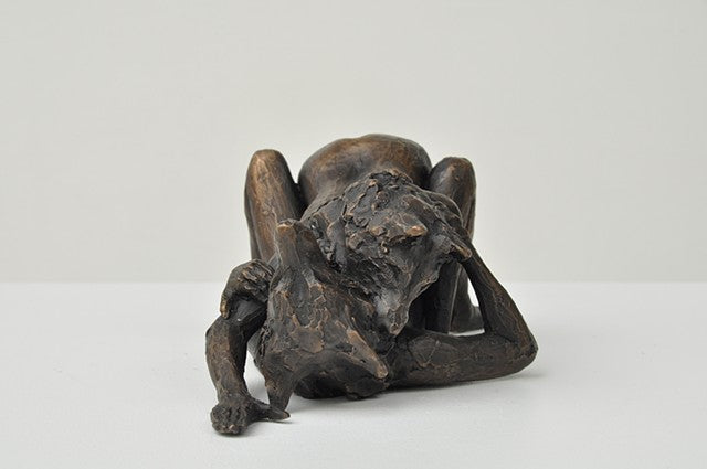 She Wolves in double. One She Wolf pinning down another. Individual cast bronze sculpture, approx. 7" x 4" x 3".