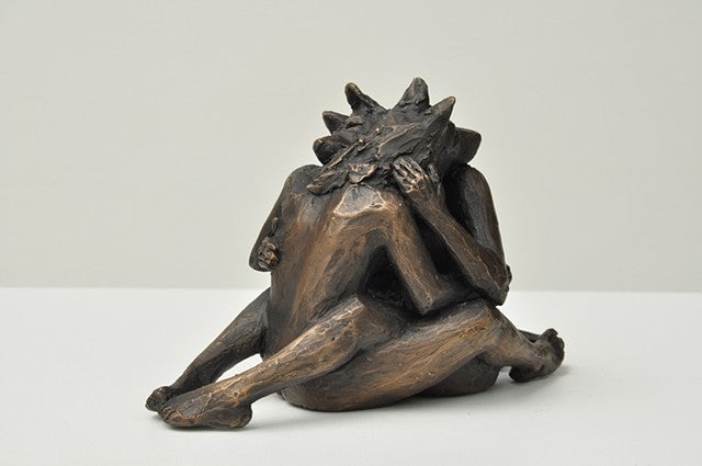 She Wolves in double. Two She Wolves in a face-to-face embrace. Individual cast bronze sculpture, approx. 7" x 4" x 3".