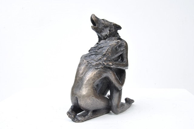 Anna Williams She Wolves in double. Two She Wolves sitting face-to-face, holding one another. Individual cast bronze sculpture, approx. 7" x 4" x 3".