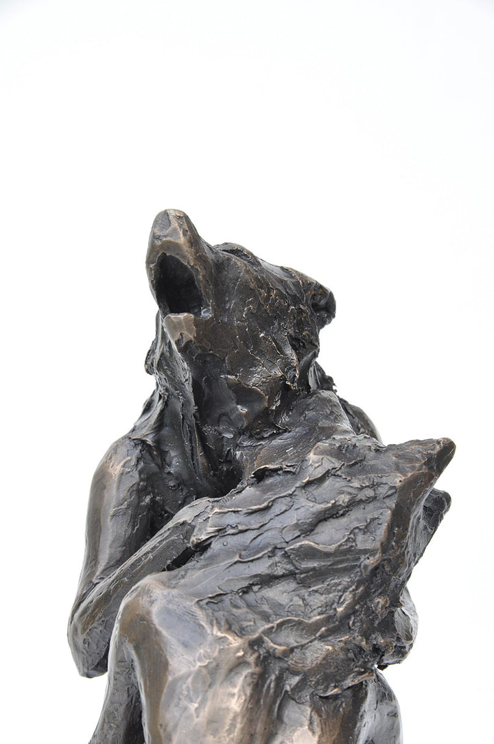 Anna Williams She Wolves in double. Two She Wolves sitting face-to-face, holding one another. Individual cast bronze sculpture, approx. 7" x 4" x 3".