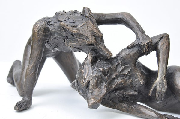 Anna Williams She Wolves in double. One She Wolf biting the neck of another. Individual cast bronze sculpture, approx. 7" x 4" x 3".
