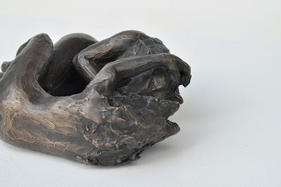 Anna Williams She Wolves in double. Two She Wolves lying face-to-face. Individual cast bronze sculpture, approx. 7" x 4" x 3".