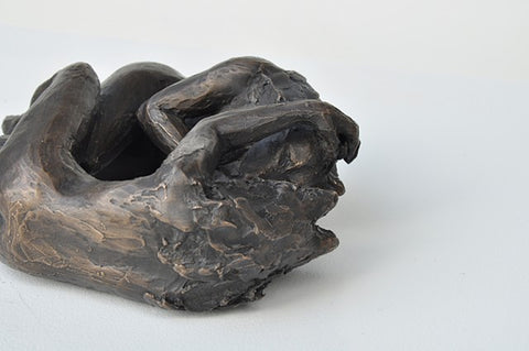 Anna Williams She Wolves in double. Two She Wolves lying face-to-face. Individual cast bronze sculpture, approx. 7" x 4" x 3".