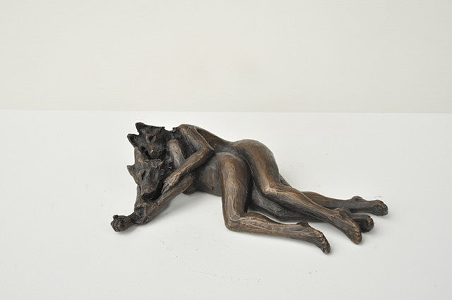 She Wolves in double. Two She Wolves in a back-to-back embrace. Individual cast bronze sculpture, approx. 7" x 4" x 3".