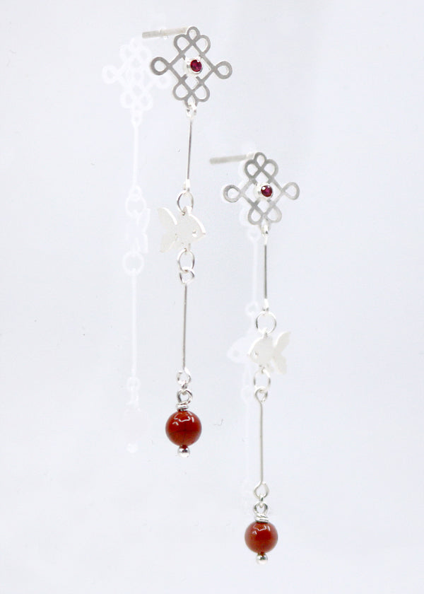 Feeesh Amulet earrings of sterling silver, ruby, and jasper beads.  These earrings feature a hand-cut amulet and fish motifs with red gem accents. This is a one of a kind design.