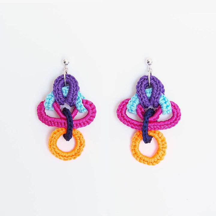 Femina Earrings in violet - made from woven polyester threads and sterling silver hooks. Light and fun to wear, these impressive pieces are one of a kind.   4.3 x 7 x 2.2 cm