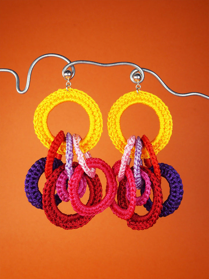 Agrumes drop studs in yellow, pink, red, and mustard yellow - made from crocheted polyester threads and sterling silver hooks.