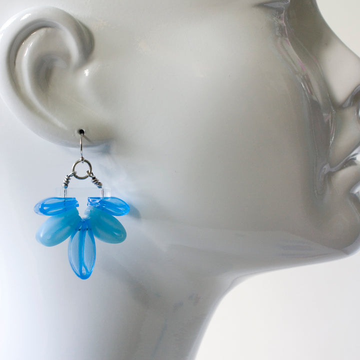 Blue Bloom Earrings of silicone, acrylic, and sterling silver.