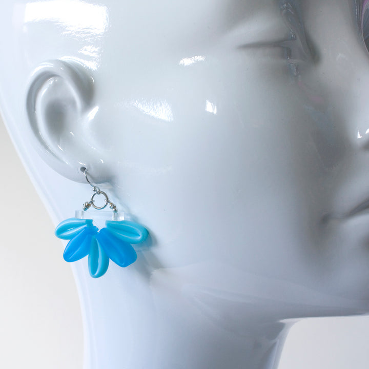 Bright blue Bloom Earrings of silicone, acrylic, and sterling silver.