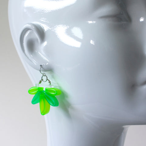 Bright green Bloom Earrings of silicone, acrylic, and sterling silver.