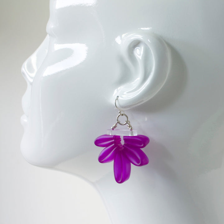 Purple Bloom Earrings of silicone, acrylic, and sterling silver.