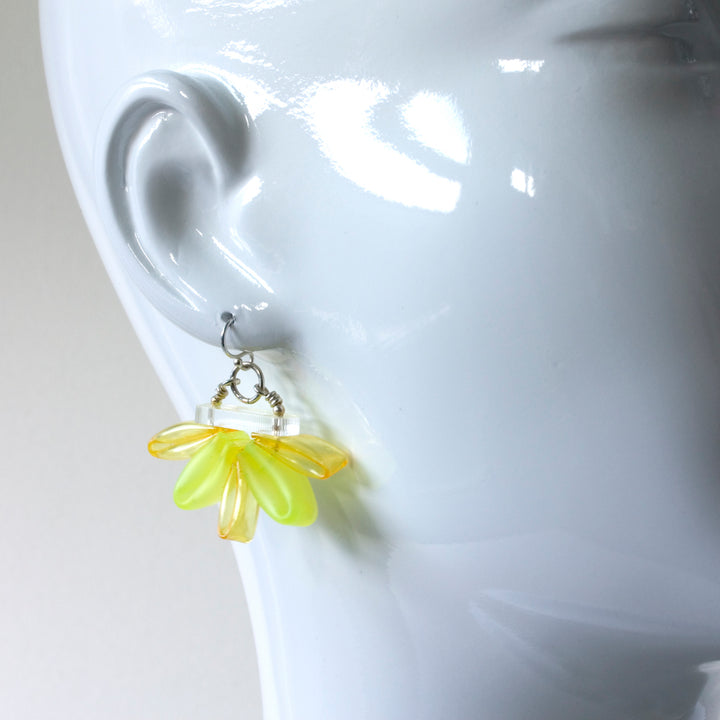 Yellow Bloom Earrings of silicone, acrylic, and sterling silver.