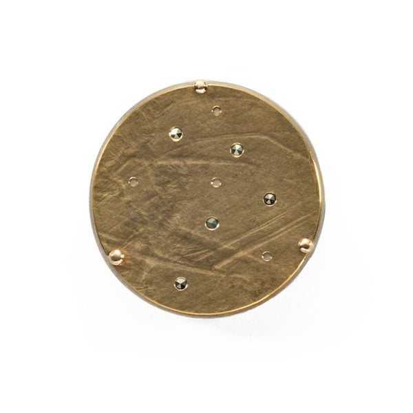Brass disc brooch on a sterling silver back plate with 18k gold and marcusite details; diameter 3 cm