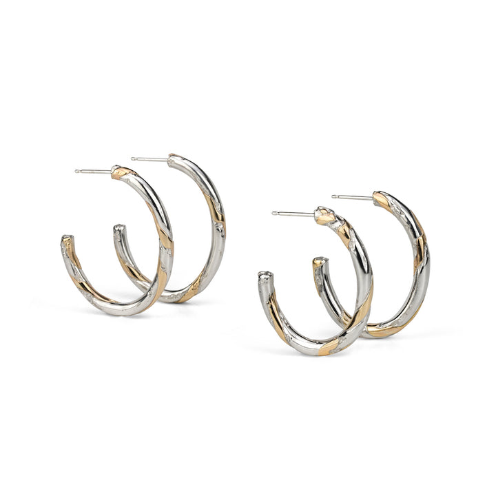 Core Sample Oval Hoop Earrings made from sterling silver and 14k yellow gold using wire lamination technique.