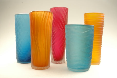 Carved Vessels in gem colours that are perfect for flowers but stunning forms without. 